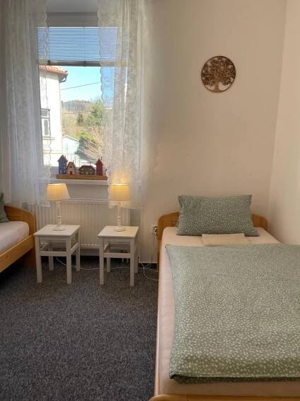 Postel nebo postele na pokoji v ubytování Penzion Ječmínek