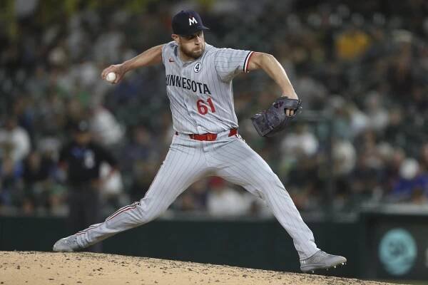 Minnesota Twins pitcher Brock Stewart throws a pitch against the Athletics in June.