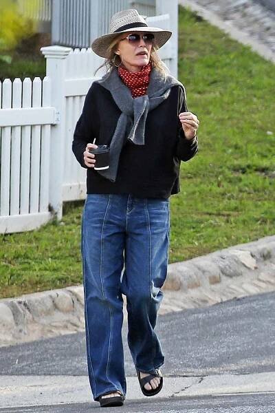 Steven Spielberg his wife Kate Kapshaw are joined by Michelle Pfiefer and her husband David E. Kelly created abide by Social distancing rules as they take a walk around Spielbergs Pacific Palisades neighborhood