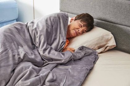 Person napping under a ZZZhen High Breathability Weighted Blanket
