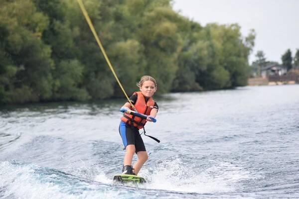 young girl wakeboarding