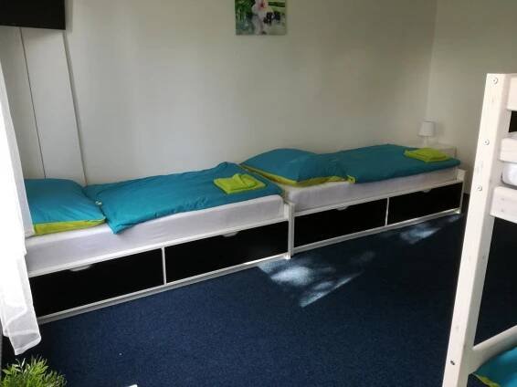 Postel nebo postele na pokoji v ubytování Sporthotel Zimní stadion Benešov