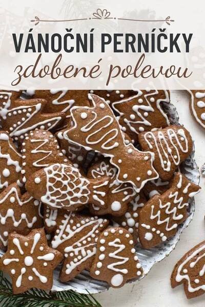 a plate full of cookies with white icing on them and the words vanocni pernickky
