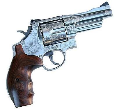 Mountain Gun engraved by John K. Pease and Wayne Di'Angelo through the Smith & Wesson Custom Engraving Shop.