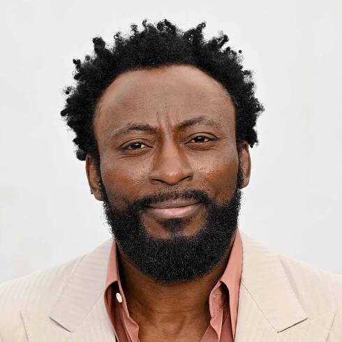Babs Olusanmokun with short twists and beard