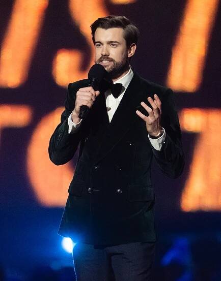 Jack Whitehall presenting at an awards ceremony.