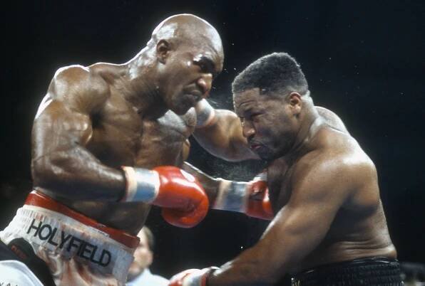 ATLANTIC CITY - MAY 20: Evander Holyfield and Ray Mercer fight in a heavyweight match on May 20, 1995 at the Convention Hall in Atlantic City, New Jersey. Holyfield won the fight with a 10 round unanimous decision. (Photo by Focus on Sport/Getty Images)