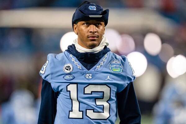 North Carolina wide receiver Tylee Craft (13) watches warm ups before the Atlantic Coast Conference championship NCAA college football game against Clemson on Saturday, Dec. 3, 2022, in Charlotte, N.C.