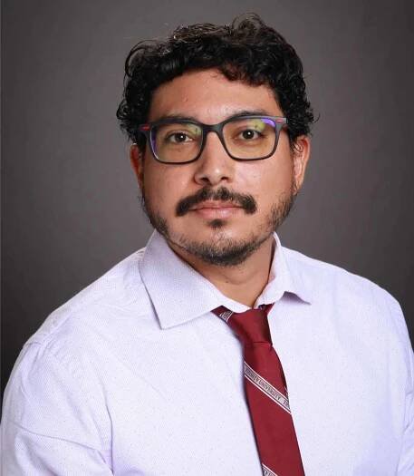 Portrait headshot of former co-host Eliseo Iglesias.