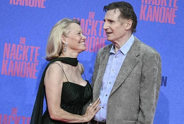 Pamela Anderson Applies Her Lip Balm on Liam Neeson During Loved-Up Live TV Appearance