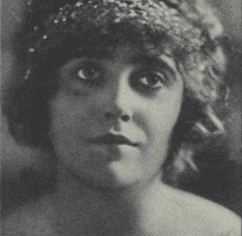 Mabel Normand  wearing head scarf 