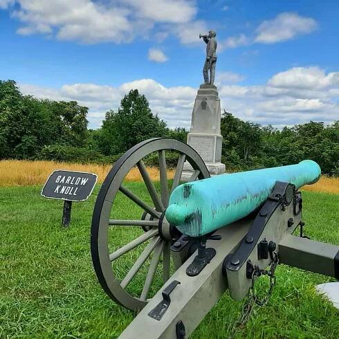 A cannon and statue of a bugler can be seen on Barlow's Knoll in Gettysburg.