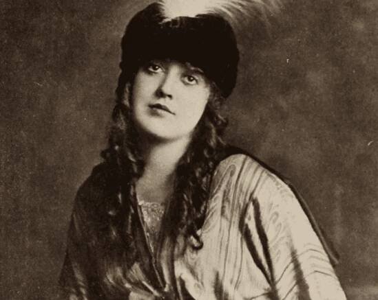 Actress Mabel Normand in dress and hat 