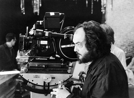 THE SHINING, director Stanley Kubrick setting up a shot, on set, 1980. ©Warner Brothers
