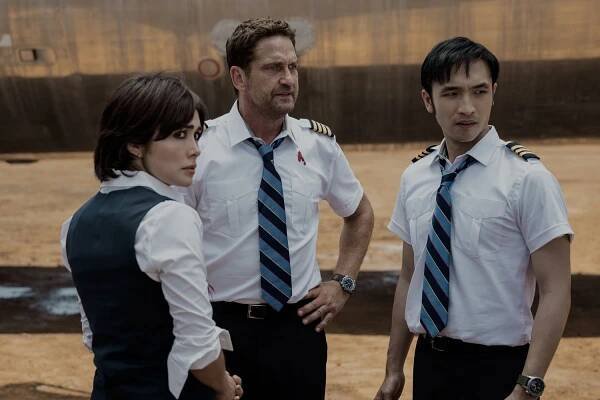 Daniella Pineda as Bonnie Lane, Gerard Butler as Brodie Torrance, and Yoson An as Samuel Dele in ‘Plane’