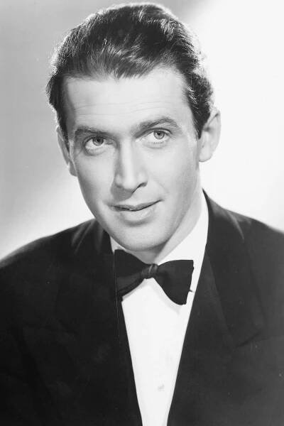 Jimmy Stewart, James Stewart (1908-1997), US actor, wearing a black dinner jacket, a white shirt and a black bow tie, in a studio portrait, against a white background, circa 1940