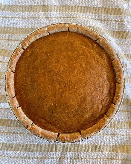 finished vegan sweet potato pie on dishtowel