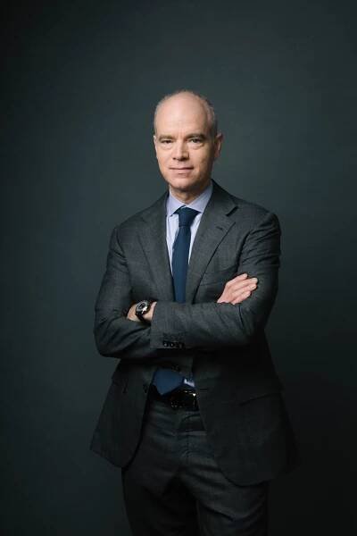 Image may contain Tie Accessories Accessory Clothing Apparel Suit Coat Overcoat Human Person Jacket and Blazer