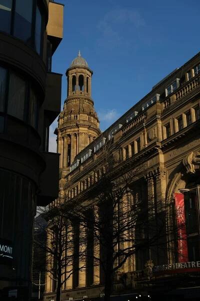 a tall building with a clock tower on top of it