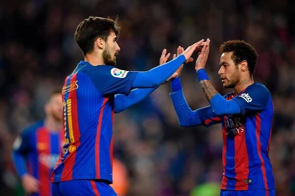 Former Valencia player Andre Gomes, left, scored his first goal for Barca right at the death