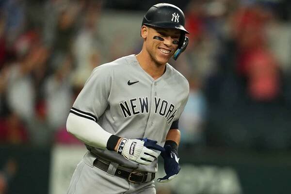 Aaron Judge #99 of the New York Yankees runs the bases after hitting his 62nd home run in the first inning breaking the American League home run record during the game between the New York Yankees and the Texas Rangers at Globe Life Field on Tuesday, October 4, 2022 in Arlington, Texas.