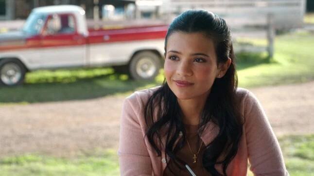 Nikki Rodriguez as Jackie in an episode 203 of My Life with the Walter Boys. She wears a pink jumper.