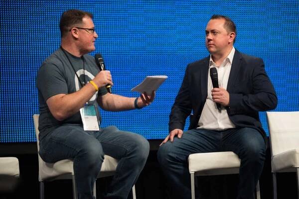 David Glass moderating a fireside chat with Nathan Pettyjohn