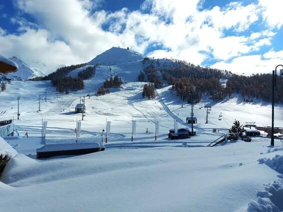 Sestriere in the Piedmont Ski Resort Via Latta in winter with lots of beautiful white snow on the mountains