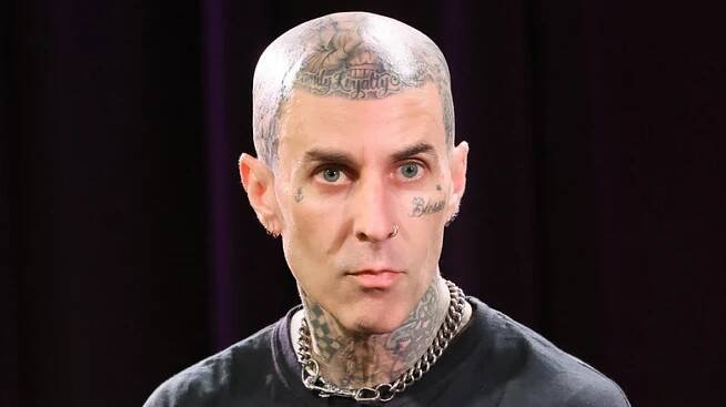 Travis Barker staring out seriously