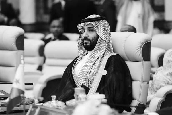Image may contain Mohammad Bin Salman Al Saud Face Human Person Couch Furniture Beard and Sitting