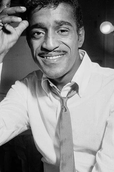 Singer Sammy Davis Jr. in his dressing room during an interview for his BBC television special 'Meet Sammy Davis Jr.', April 11th 1963.