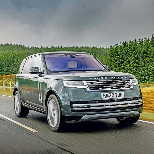 2025 Range Rover RHD green exterior front three quarter view driving square