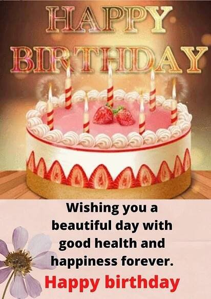 a birthday cake with candles and flowers on it, says wishing you a beautiful day with good health and happiness forever