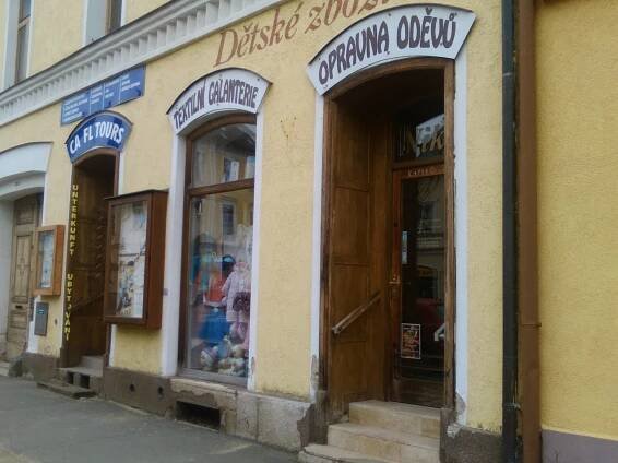 a store with the doors open on a street at Apartma Františkovy Lázně in Františkovy Lázně