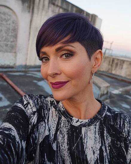 Sleek pixie cut for straight hair with undercut and deep purple hue