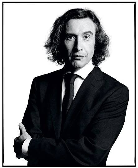 Image may contain Coat Clothing Overcoat Apparel Suit Human Person Tie Accessories Accessory Man and Face