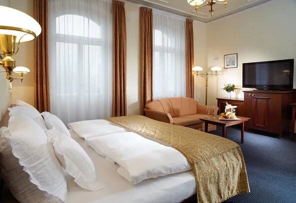 Postel nebo postele na pokoji v ubytování Hotel Excelsior