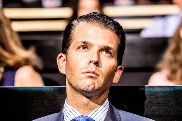 Image may contain Donald Trump Jr. Face Human Person Tie Accessories Accessory Necktie Suit Coat and Clothing