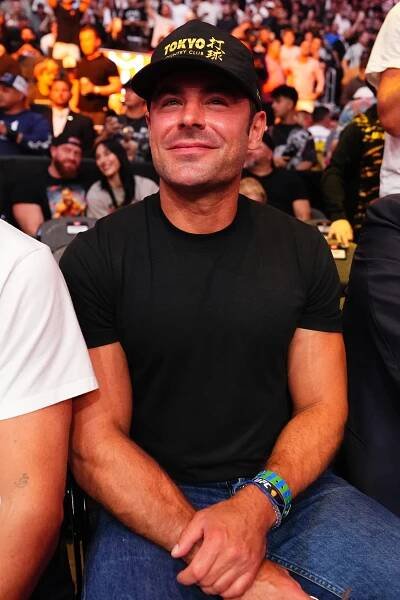 Zac Efron and Buddy Murphy sitting in attendance at the UFC 314 event in Miami, Florida on April 12, 2025