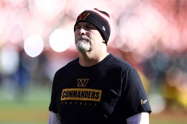 LANDOVER, MARYLAND - DECEMBER 22: Head coach Dan Quinn of the Washington Commanders looks on prior to the game against the Philadelphia Eagles at Northwest Stadium on December 22, 2024 in Landover, Maryland.