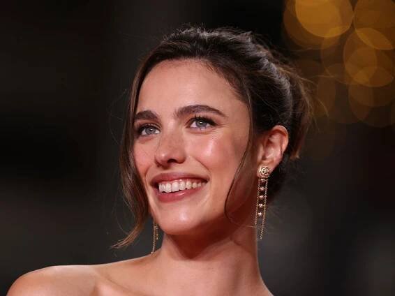 Margaret Qualley wears a Chanel dress and flats on the red carpet in Cannes