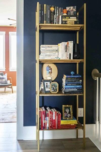 picture frames displayed on bookshelf