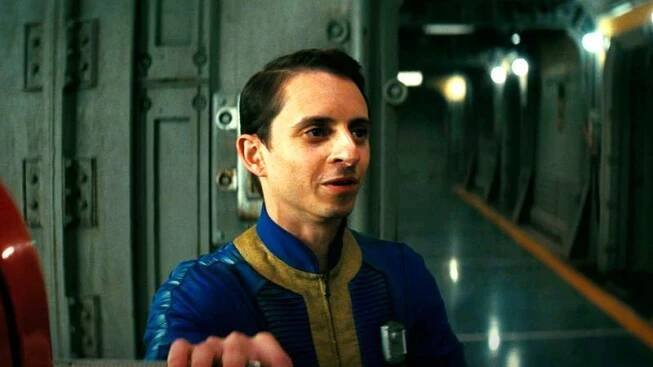 Moises Arias as Norm in Vault Dweller gear in Fallout on Amazon Prime Video
