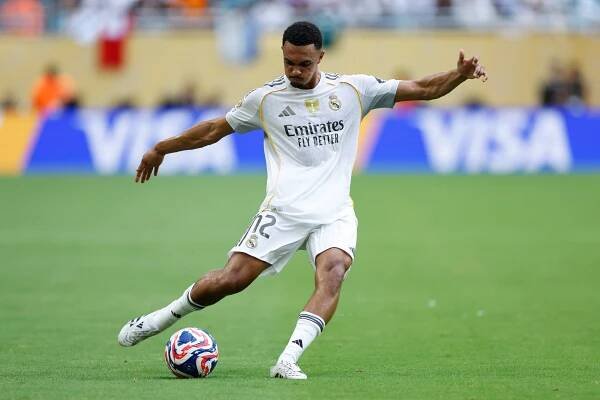 Trent Alexander-Arnold of Real Madrid kicking a soccer ball.
