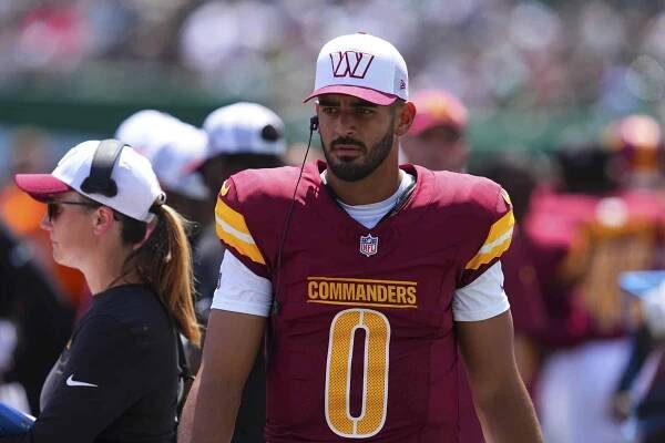 EAST RUTHERFORD, NEW JERSEY - AUGUST 10: Marcus Mariota #0 of the Washington Commanders looks on against the New York Jets in the first half of the preseason game against at MetLife Stadium on August 10, 2024 in East Rutherford, New Jersey. The Jets defeated the Commanders 20-17.