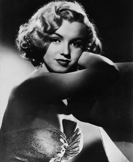 This undated photo shows actress Marilyn Monroe. In late 2012, the FBI has released a new version of files it kept on Monroe that reveal the names of some of her acquaintances who had drawn concern from government officials and members of her entourage over their suspected ties to communism.