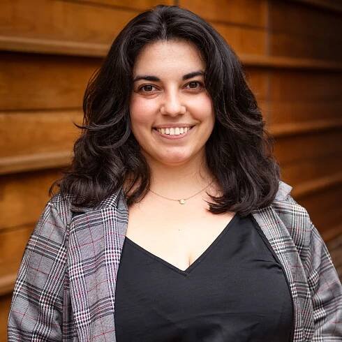 Young woman with dark hair smiling