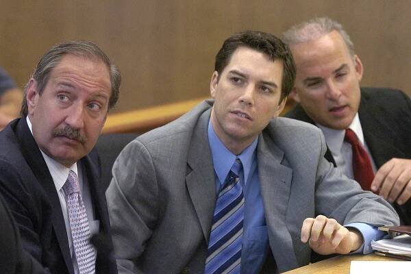 FILE - Scott Peterson, center, with defense attorneys Mark Geragos, left, and Pat Harris listens to judge Alfred A. Delucchi in a Redwood City, Calif., courtroom, Thursday, July 29, 2004. On Monday, August 24, 2020, the California Supreme Court overturned the 2005 death sentence for Peterson in the slaying of his pregnant wife. The court says prosecutors may try again for the same sentence if they wish in the high-profile case. It upheld his 2004 conviction of murdering Laci Peterson, who was eight months pregnant with their unborn son. (Al Golub/The Modesto Bee,Pool)