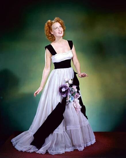 Jeanette Macdonald In A Long White Dress With Black Trim, Circa 1940.