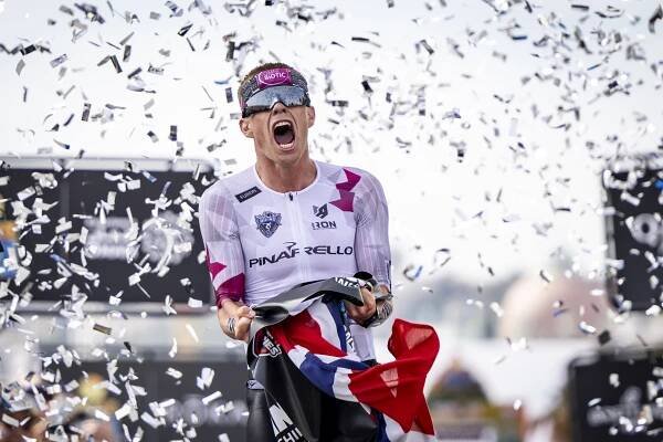 Casper Stornes celebrates after winning the world title on debut in Nice. Pic credit: Jan Hetfleisch/Getty Images for IRONMAN